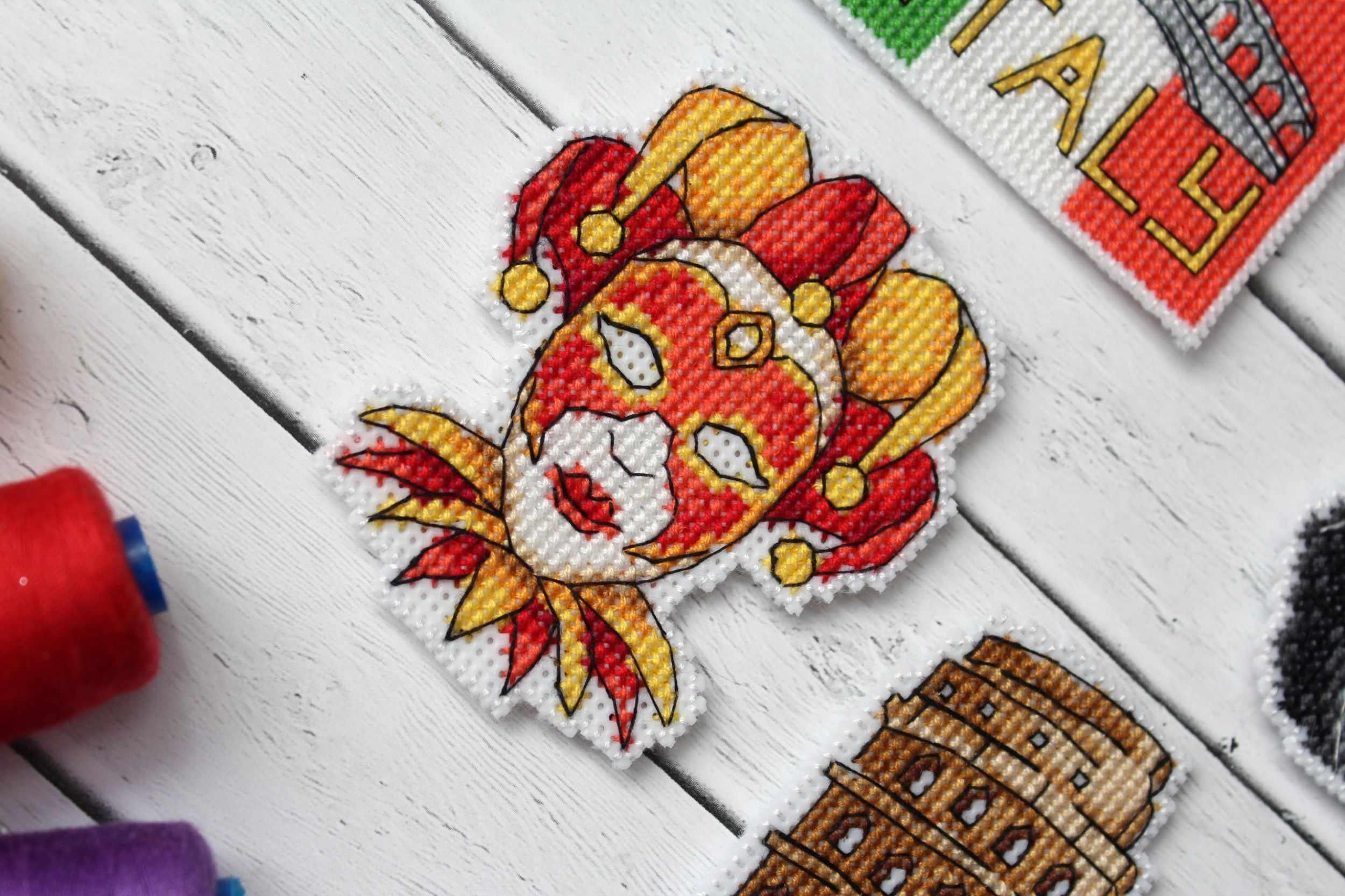 Italy Magnets P-309 / SR-309 Cross Stitch Kit featuring colorful threads and plastic canvas for crafting.